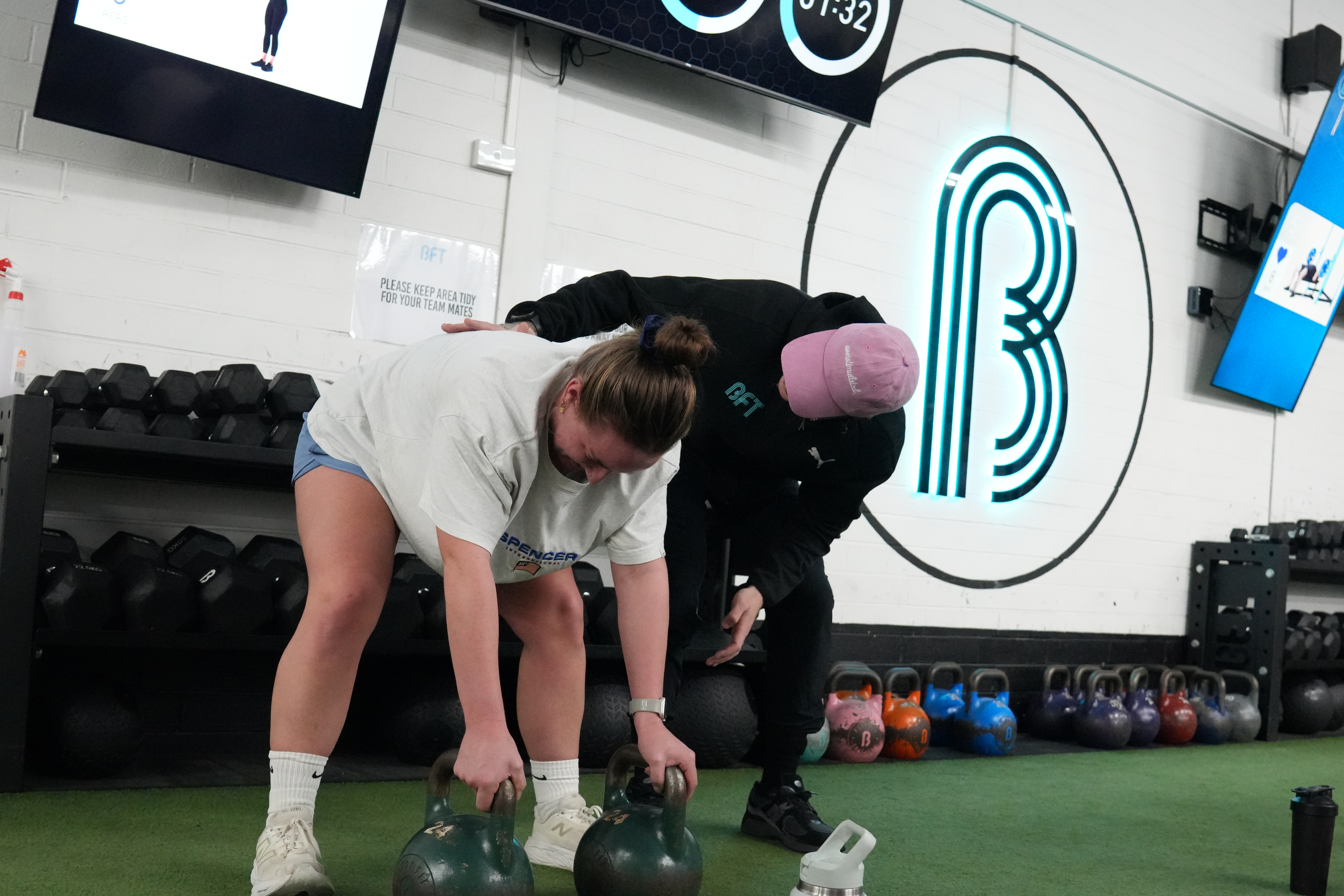 Coach correcting form at BFT Airport West